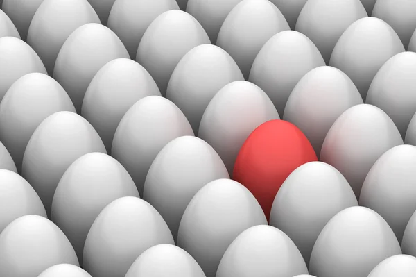Червоне пасхальне яйце серед подібних білих яєць — стокове фото