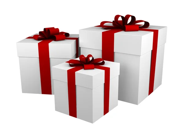 Три белых подарочных коробки с красной лентой — стоковое фото