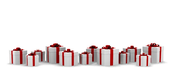 Witte geschenkdozen met rood lint — Stockfoto