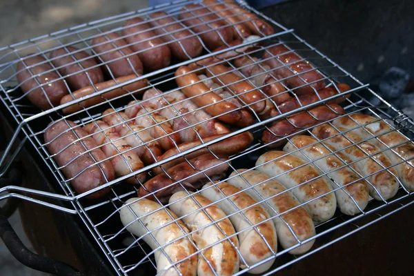 Sausages on a grill — Stock Photo, Image