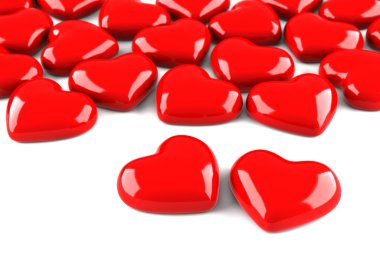 Many red hearts isolated on white