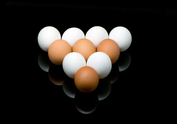 Pool eggs on a black background — Stock Photo, Image