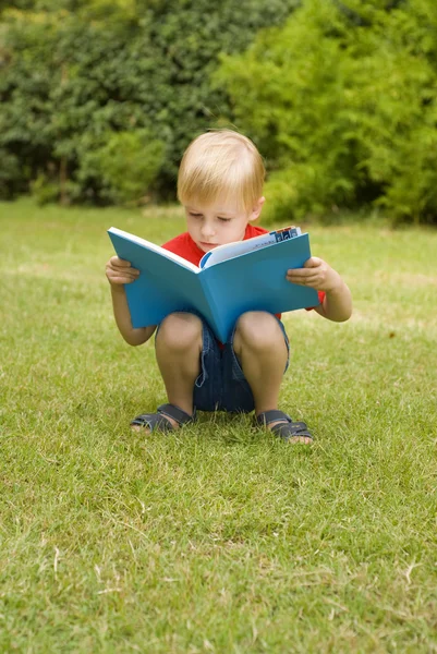 The boy with the book — Stock Photo, Image