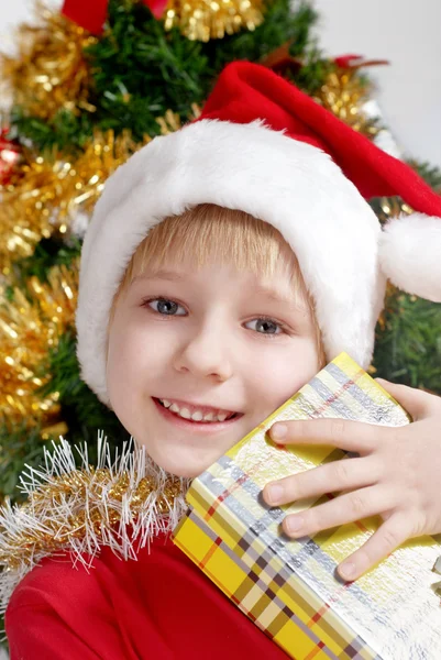 Small Santa Klaus with gifts — Stock Photo, Image
