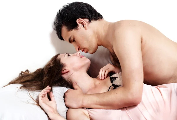 Young attractive couple in bedroom — Stock Photo, Image