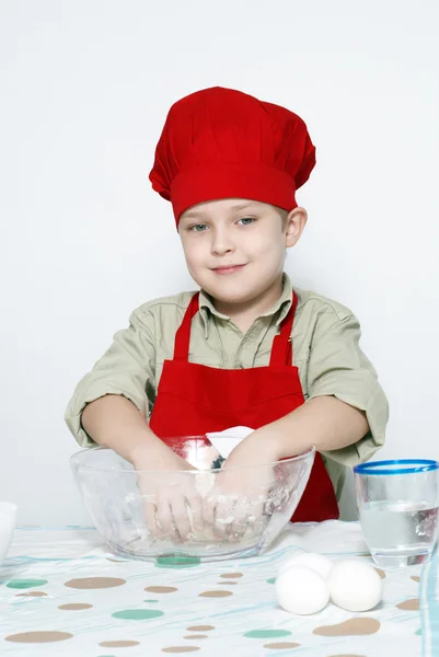 Boldog, vonzó kis cook portréja — Stock Fotó