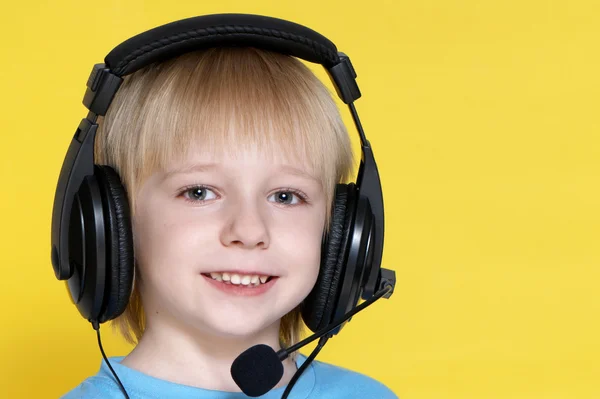 The emotional kid in ear-phones — Stock Photo, Image