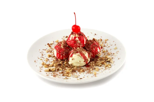 Ice-cream in nuts with a cherry — Stock Photo, Image