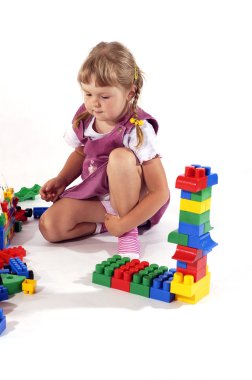 Young girl playing with blocks