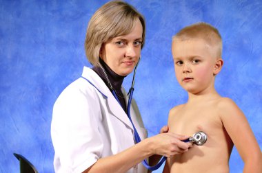 Doctor examining child clipart