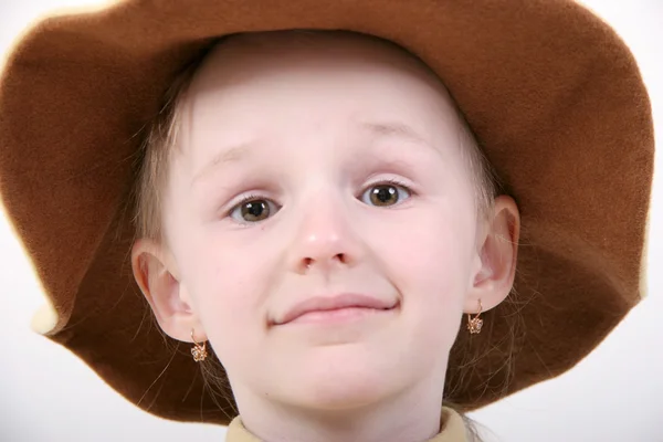 Happy girl in brown hat — Stock Photo, Image