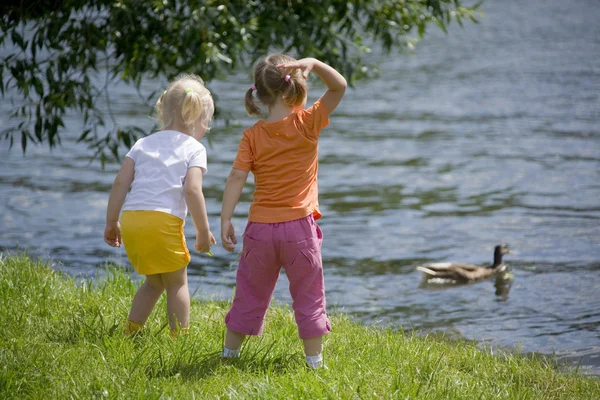 stock image Little girls playing near the river