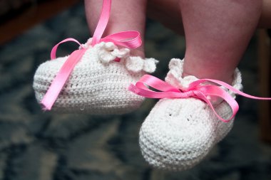 Hand-made baby's bootees clipart