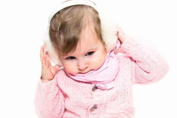 Little girl in fur headphones — Stock Photo, Image