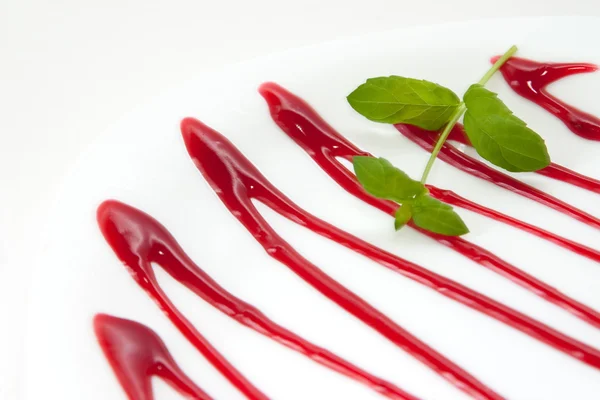 Plate decorated with cherry sauce — Stock Photo, Image