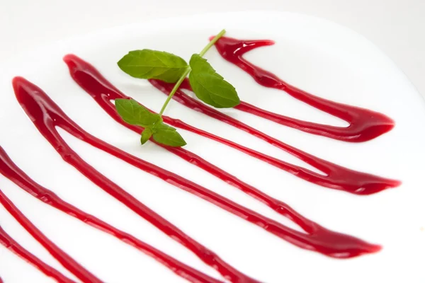 Plate decorated with cherry sauce — Stock Photo, Image