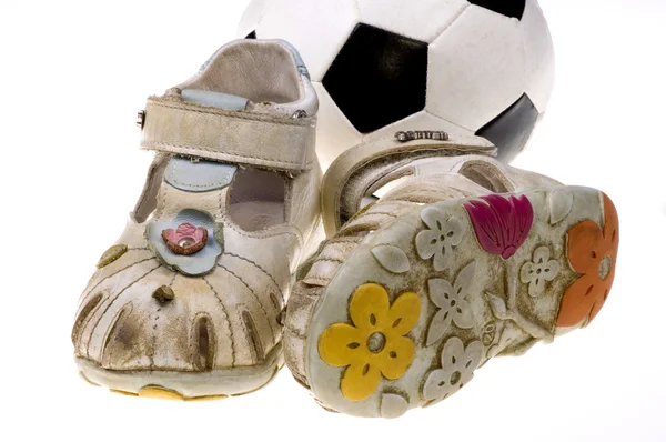 Baby football shoes and ball on white background — Stock Photo, Image