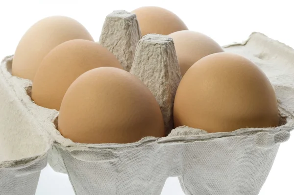 Eggs in a grey cardboard carton box — Stock Photo, Image