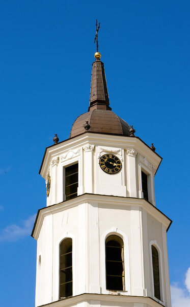 Church tower clock in Vilnius - capital of Lithuania