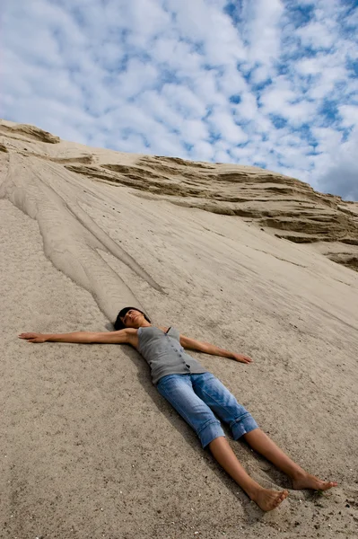 Lying on sand — Stock Photo, Image
