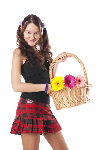 Školačka s košíkem květin — Stock fotografie