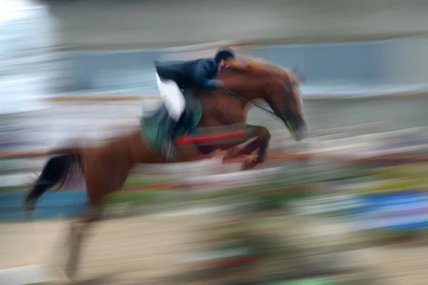 Jump a horse through the barrier — Stock Photo, Image