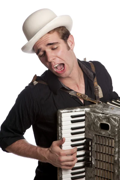 Мужчина с аккордеоном и шляпой — стоковое фото