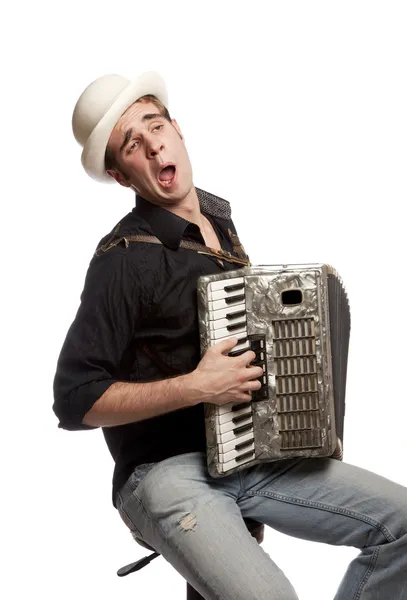 Чоловік з акордеоном і капелюхом — стокове фото