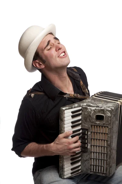 Чоловік з акордеоном і капелюхом — стокове фото