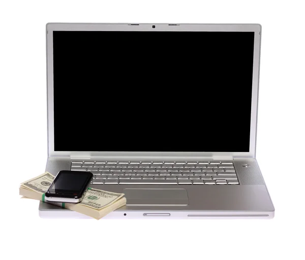 Laptop with cellphone and US money — Stock Photo, Image