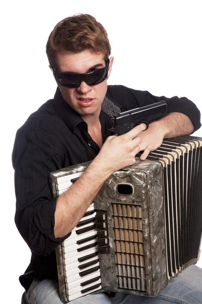 Man met accordeon en gun — Stockfoto
