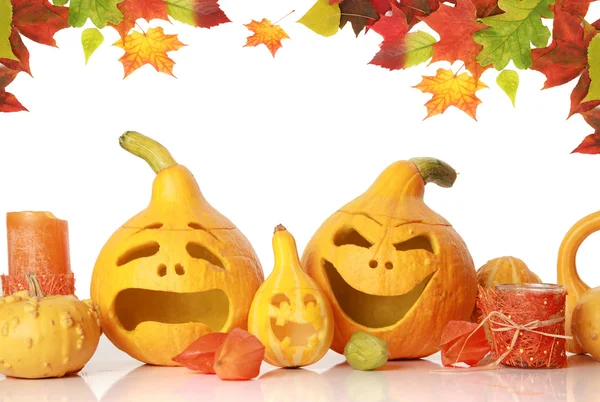Pumpkins with funny faces on white — Stock Photo, Image