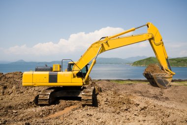 Excavator on a working platform clipart