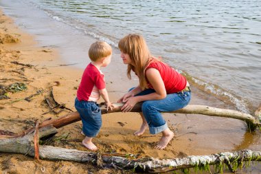 Mother and son. beach clipart