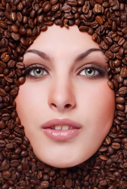 Woman's face with coffee beans clipart