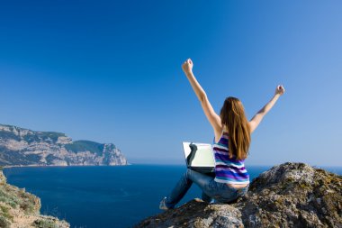 Woman with laptop and sea clipart