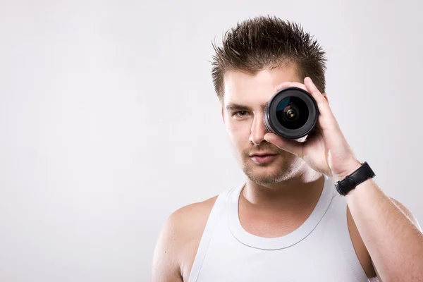 Man and lens — Stock Photo, Image