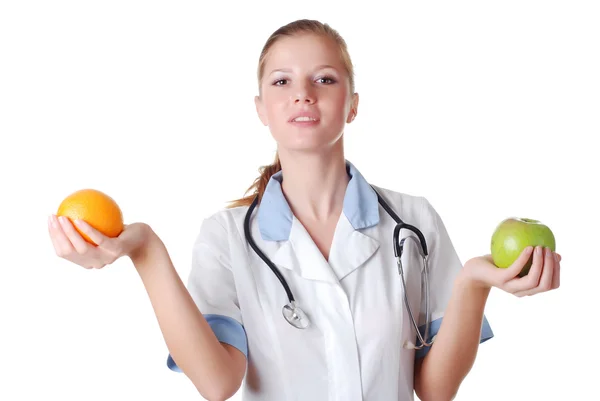 Enfermera con estetoscopio y frutas —  Fotos de Stock