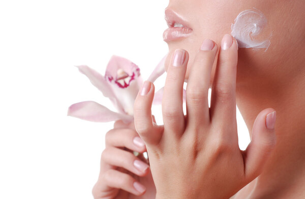 Face of woman and orchid