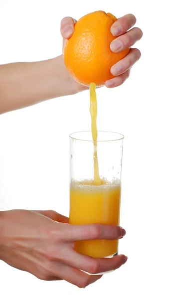 Hands and glass of juice — Stock Photo, Image