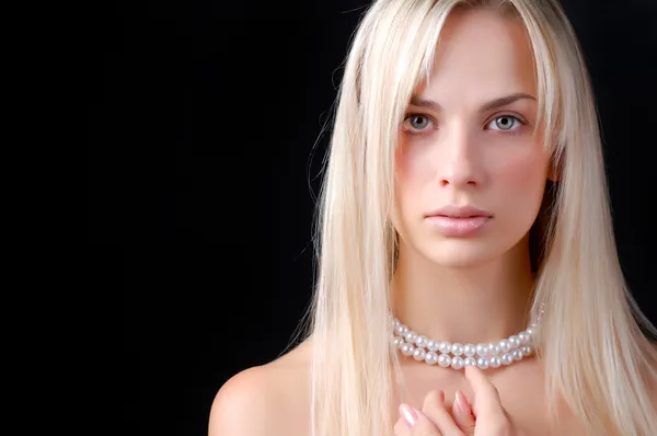 Face of woman and pearl necklace Stock Photo