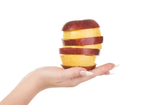 Кусочки яблок и женская рука — стоковое фото