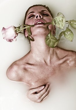 Woman in bath with rose clipart