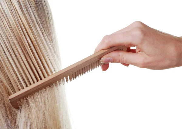 Длинные волосы и расческа — стоковое фото