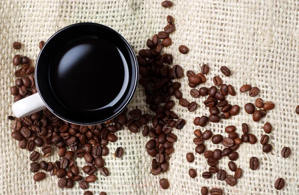Cup of coffee and coffee beans — Stock Photo, Image