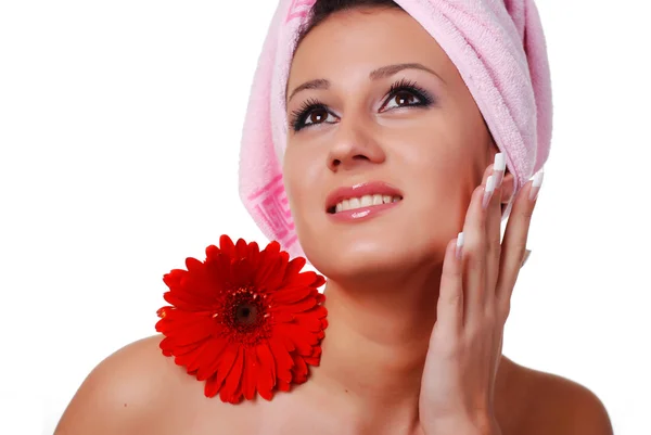 Woman in towel and flowers — Stock Photo, Image