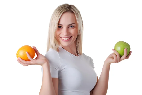 Vrouw met groene apple en oranje — Stockfoto