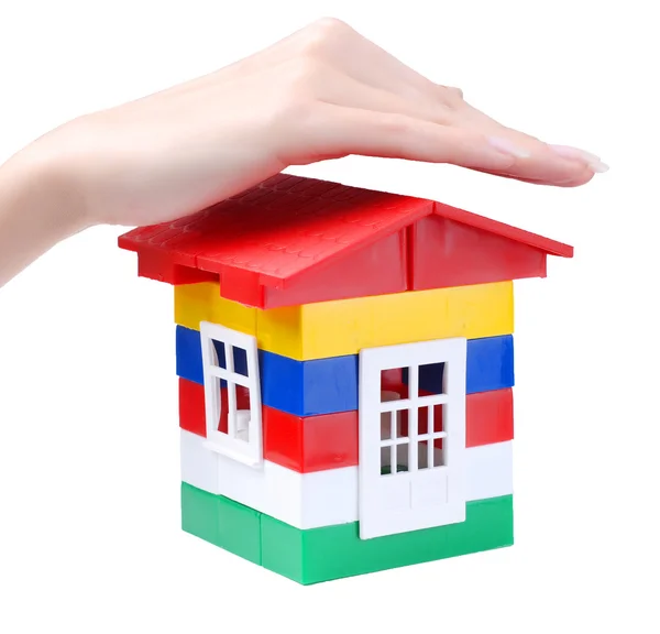 Hand and toy colour house Stock Image