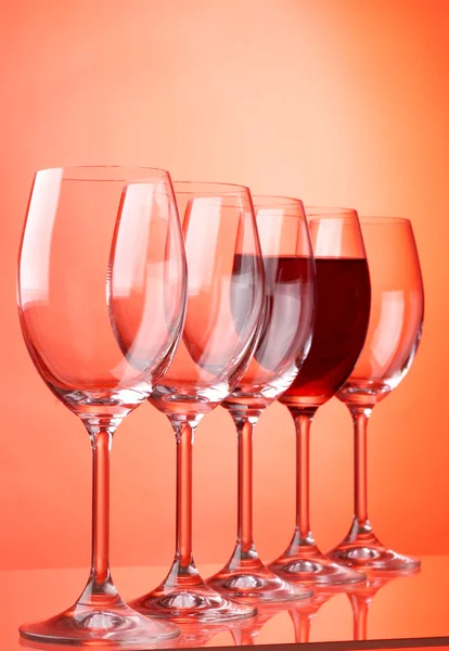 Wine glasses on red background — Stock Photo, Image