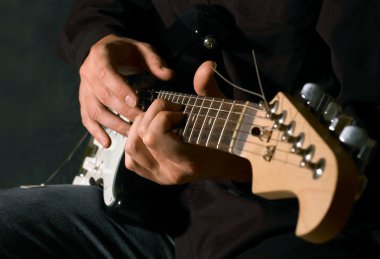 Musician playing electric guitar clipart